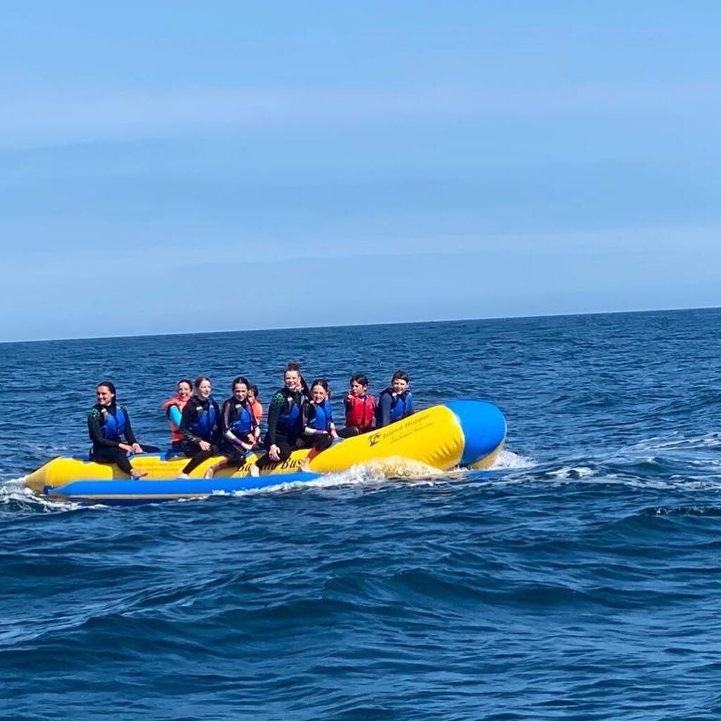 The banana bus full of riders out beyond Ardmore Bay