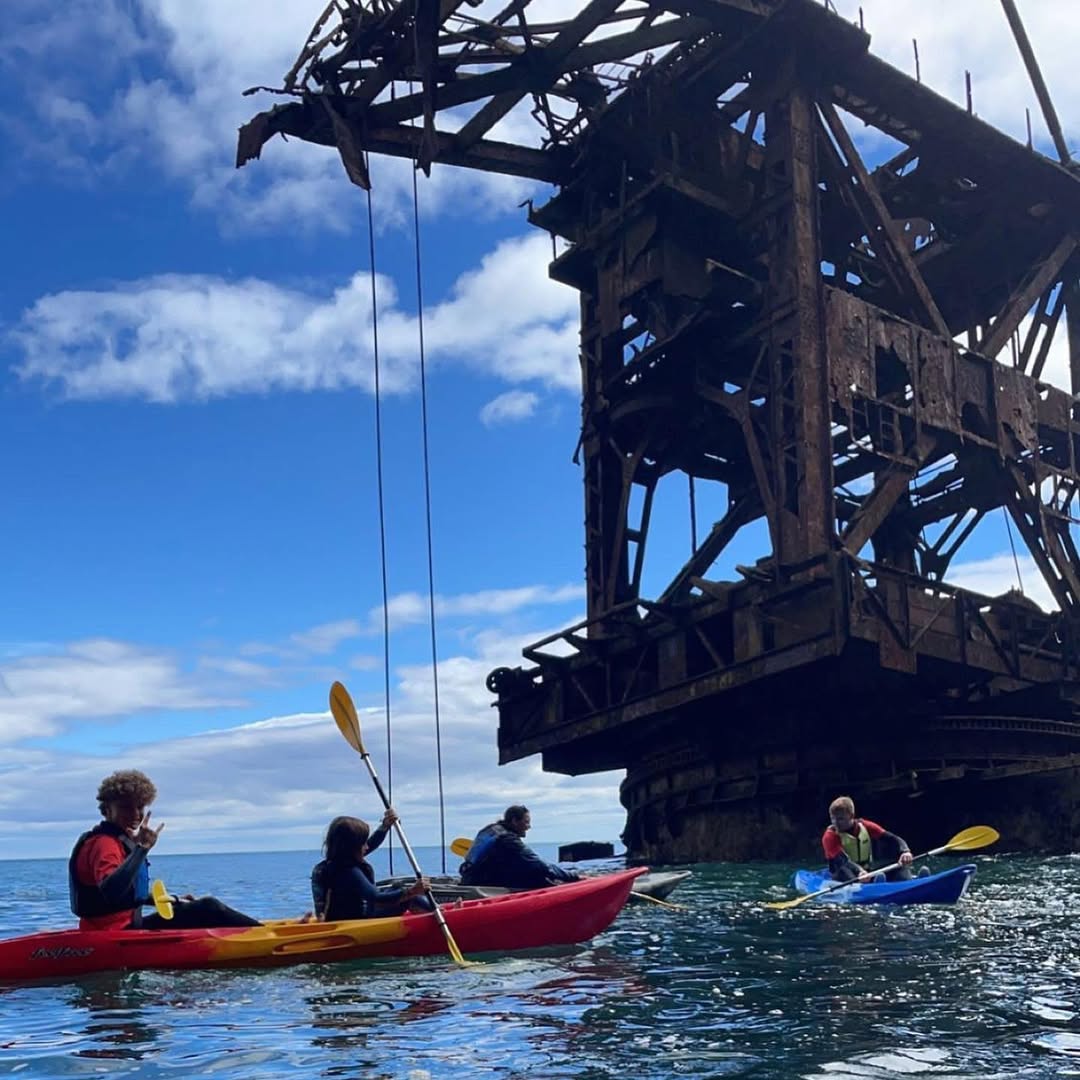 Kayakers beside the Samson shipwreck